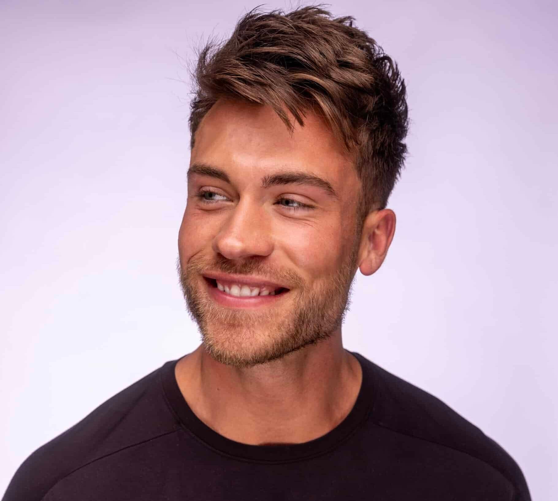 Men's short haircut that's shorter on the sides and longer hair on top.